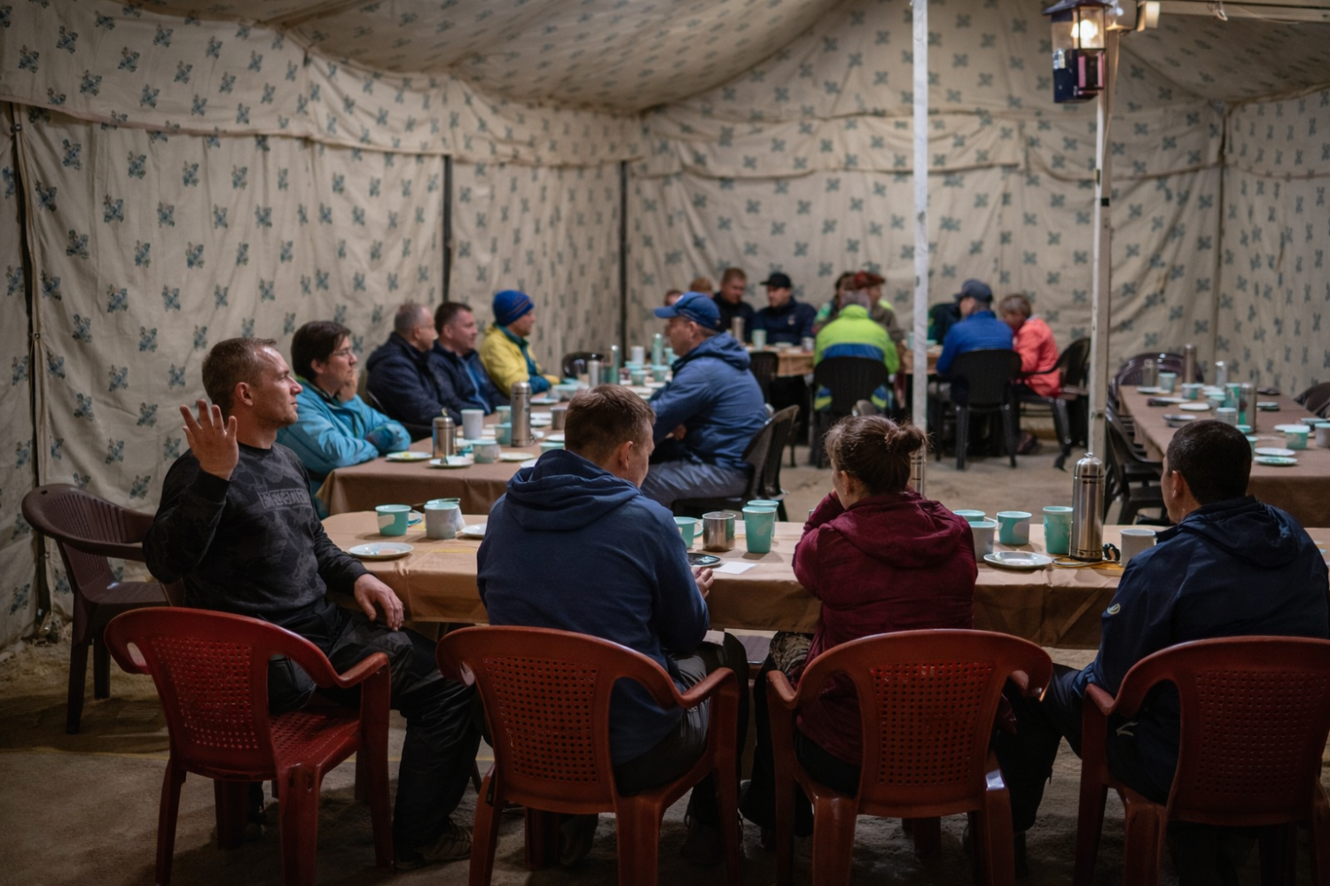 Interior of the common dining tent at Sarchu where guests enjoy freshly cooked buffet meals and warm local tea.