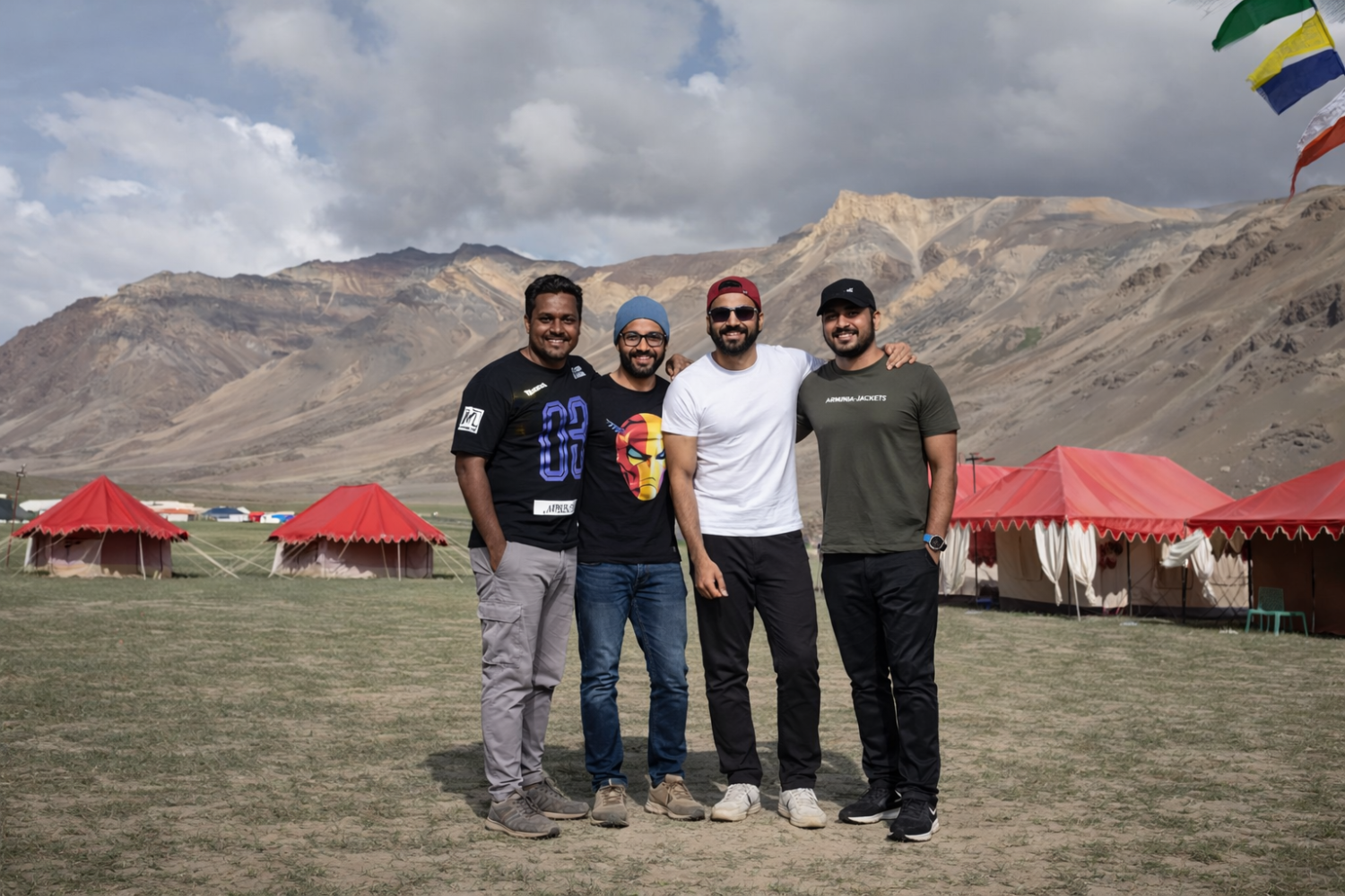 Happy group of international tourists enjoying hospitality at our Sarchu campsite, suitable for large expeditions and groups