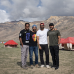Happy group of international tourists enjoying hospitality at our Sarchu campsite, suitable for large expeditions and groups