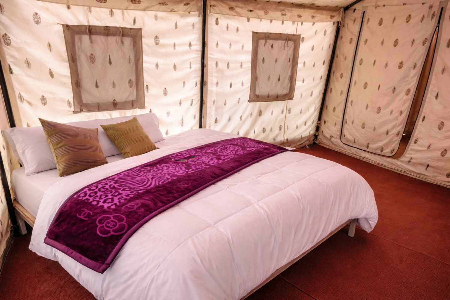 Deluxe Swiss tent at Himalayan Routes Sarchu featuring attached washroom, clean white linens.